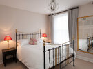 Hart Street Apartment-1 - Double bedroom with decorative cushions in Edinburgh holiday let