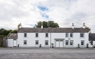Fleet Cottages in Rural Scotland - Grand white building amongst green fields and forest