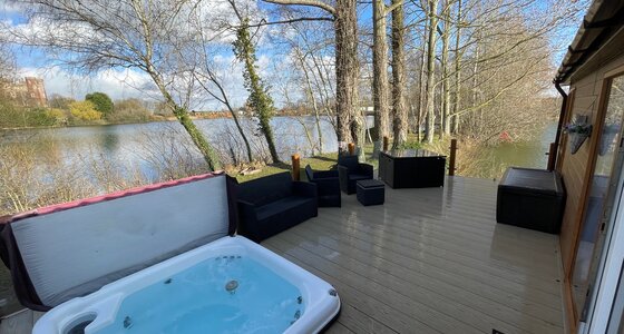hot tub lake view - side of veranda over looking two lakes with hot tub