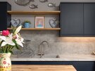 Breakfast Bar with Stylish Seating - Relax with morning coffee or evening drinks at the breakfast bar, complete with comfortable pink bar stools, contemporary sink and open shelving. A sociable space designed for modern city living.