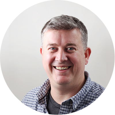 Robin Morris - Photo of Robin Morris, a man smiling and looking relaxed, wearing a checked shirt in a professional staff photo for Bookster Marketing Software. Robin Morris - Photo of Robin Morris, a man smiling and looking relaxed, wearing a checked shirt in a professional staff photo for Bookster Marketing Software.