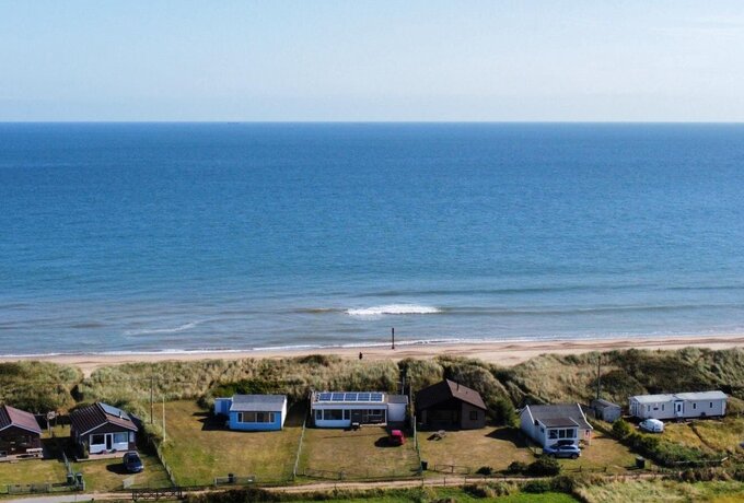 A view of Eccles on Sea Beach from above. - With the sea behind and stunning countryside views  to the front you have the best of both worlds. With a large dog proof garden and plenty of space for parking.