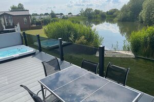 Hot tub, lake view - Balcony lake view with hot tub and private fishing peg