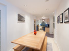 York Place Residence-20 - Wooden family dining table, leading from modern kitchen