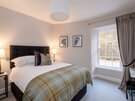Master Bedroom in a Vacation Rental - Master Bedroom with king-size bed and tartan throw in Edinburgh, West End Master Bedroom in a Vacation Rental - Master Bedroom with king-size bed and tartan throw in Edinburgh, West End