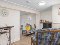 Open plan kitchen, breakfast bar and comfortable lounge areas