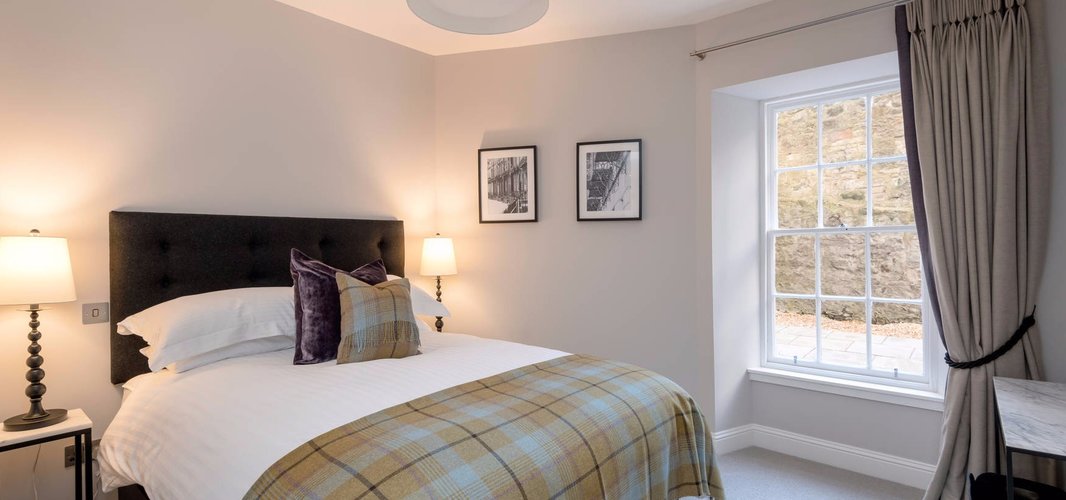 Stafford Street Apartment Master Bedroom - Master Bedroom with kingsize bed and tartan throw in Edinburgh West End Apartment.