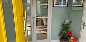 An entry porch leads the way to your stay