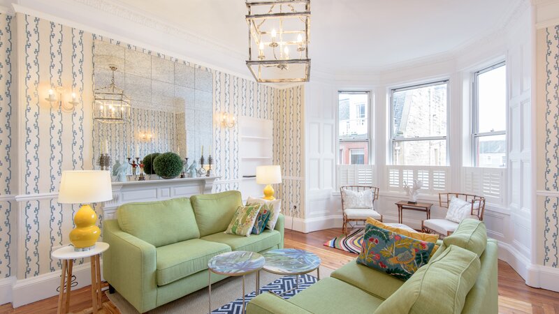 East Cliff (living room) - Living room at North Berwick holiday let with comfortable sofas and feature wallpaper.