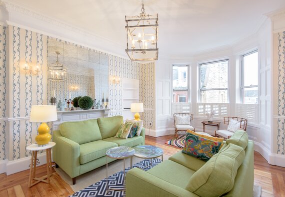 East Cliff (living room) - Living room at North Berwick holiday let with comfortable sofas and feature wallpaper.