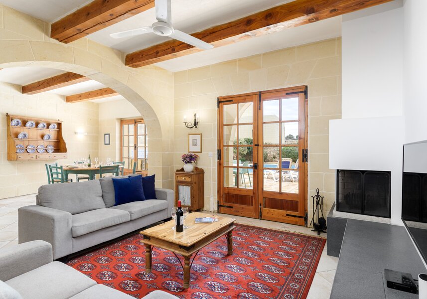 Dar ta' Lonza living room with wood burning fireplace