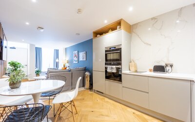 Open Plan - Superb open-plan living room and a fully equipped kitchen with a clean, contemporary design.