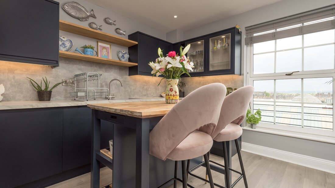 Spacious Kitchen with Views over the Firth of Forth - Natural light floods the kitchen through large north-facing windows, offering beautiful views towards the Firth of Forth. The spacious layout combines luxury finishes with one of Edinburgh's most desirable city-centre locations.