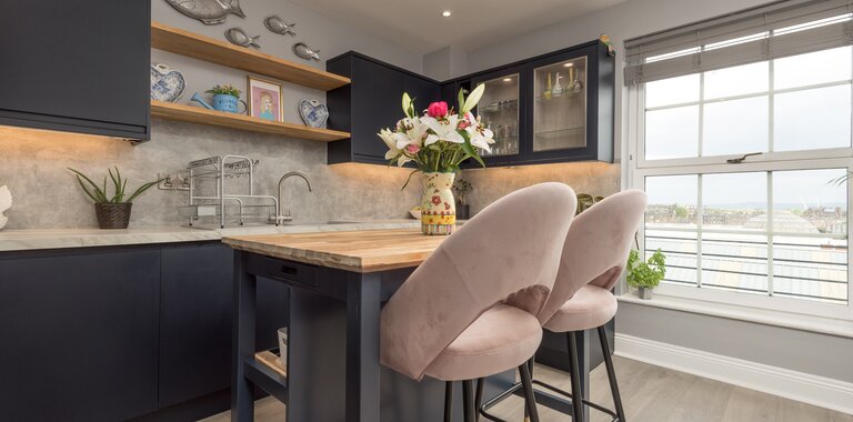 Spacious Kitchen with Views over the Firth of Forth - Natural light floods the kitchen through large north-facing windows, offering beautiful views towards the Firth of Forth. The spacious layout combines luxury finishes with one of Edinburgh's most desirable city-centre locations.