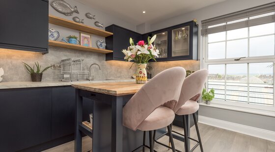 Spacious Kitchen with Views over the Firth of Forth - Natural light floods the kitchen through large north-facing windows, offering beautiful views towards the Firth of Forth. The spacious layout combines luxury finishes with one of Edinburgh's most desirable city-centre locations.