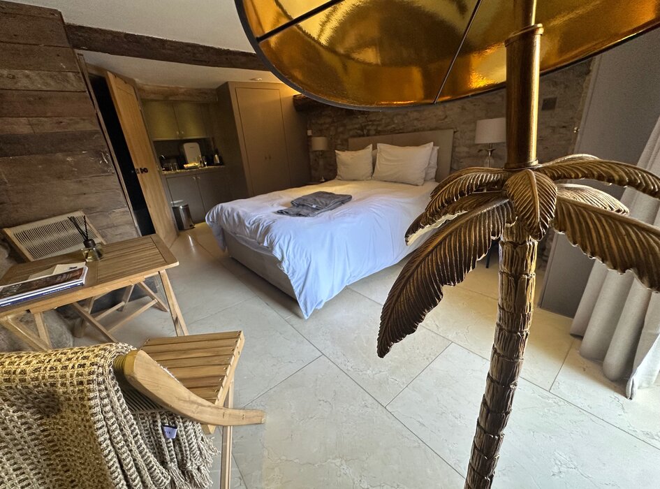 Bedroom The Undercroft - View of bedroom. Polished marble floor. King size bed by Sleep. Table and chairs