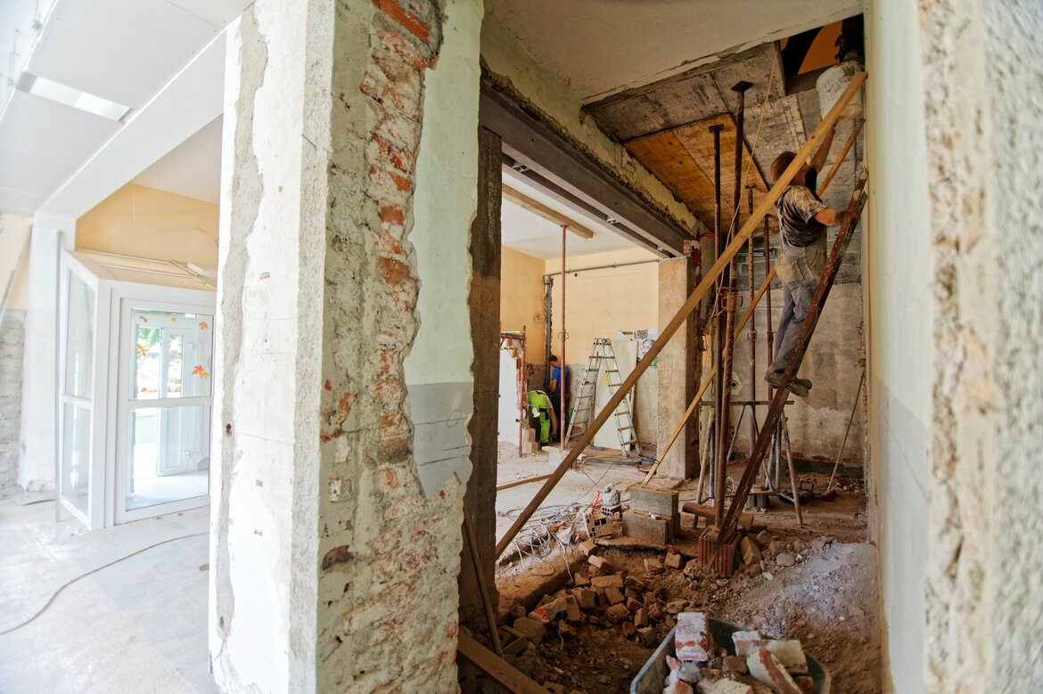 Temporary accommodation during house renovation - Inside a property with walls removed and work in progress (© Photo by Milivoj Kuhar on Unsplash)