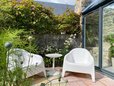 Seating area in garden in Scottish coastal town