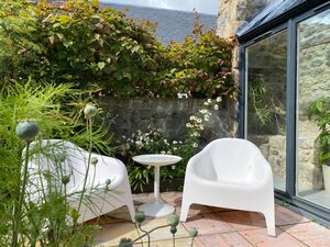 Seating area in garden in Scottish coastal town