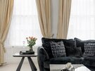 Cosy Lounge Area for Business Travellers - A closer view of the living room window nook, showcasing the elegant textures and thoughtful décor that elevate the space