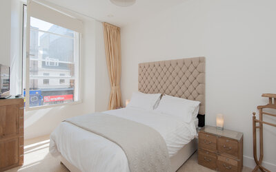 Bright and Spacious Bedroom in Edinburgh - Modern bedroom featuring a soothing beige palette with elegant wooden accents. Perfect for a stylish and comfortable retreat