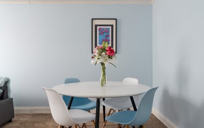 Dining Space within the Living Room - The bright open living and dining space comfortably seats four guests, making it perfect for shared meals, games evenings or planning your next Edinburgh adventure.