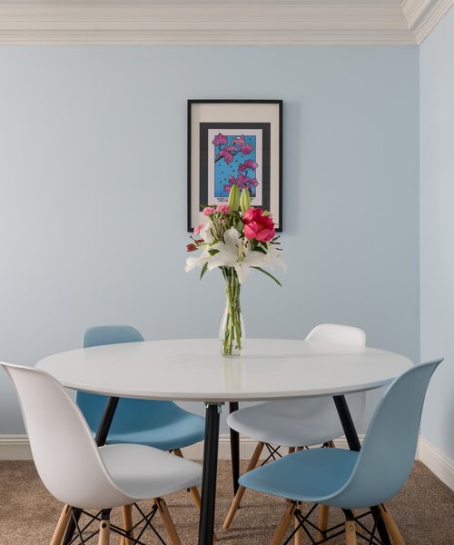 Dining Space within the Living Room - The bright open living and dining space comfortably seats four guests, making it perfect for shared meals, games evenings or planning your next Edinburgh adventure.