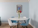 Dining Space within the Living Room - The bright open living and dining space comfortably seats four guests, making it perfect for shared meals, games evenings or planning your next Edinburgh adventure.