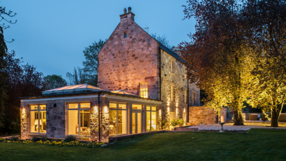 The Riverside House at night