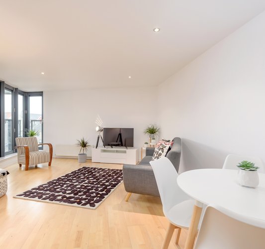 Sandport Way 2 - Spacious, contemporary open plan living room / dining area, featuring floor to ceiling windows in Edinburgh holiday apartment.