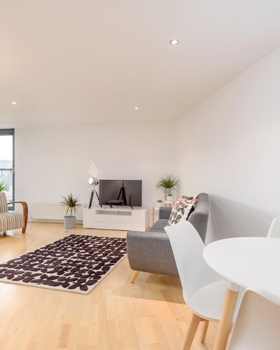 Sandport Way 2 - Spacious, contemporary open plan living room / dining area, featuring floor to ceiling windows in Edinburgh holiday apartment.