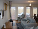 Callie's Cottage, pet friendly 2 bedroom holiday home North Berwick - Sitting area with stove (© Coast Properties)