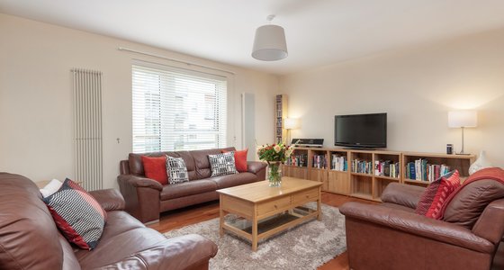 Holyrood Road 1 - Spacious family living room with comfortable leather seating