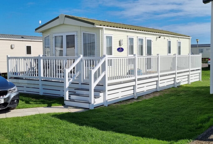 Outside View of Comber's Rest with Veranda - Outside view of Comber's Rest with verand and patio with seating area and parking space