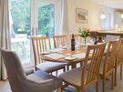 Mulberry Lodge/Carberry Tower - Grand dining table with garden views in a holiday home in Carberry Estate.