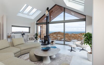 Spacious Living Room in a Holiday Let - Bright and stylish lounge area with comfortable sofas and a breath-taking view