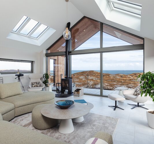 Spacious Living Room in a Holiday Let - Bright and stylish lounge area with comfortable sofas and a breath-taking view