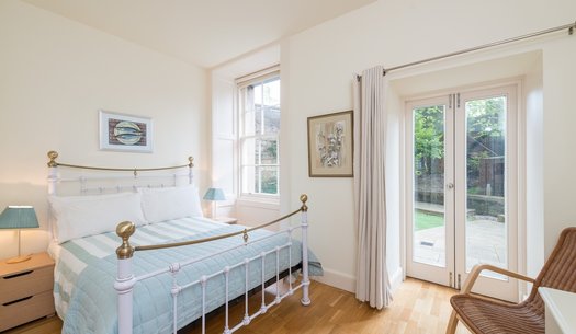 Drumsheugh Gardens Apartment Bedroom - Light, spacious bedroom with patio doors