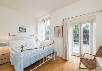 Drumsheugh Gardens Apartment Bedroom - Light, spacious bedroom with patio doors