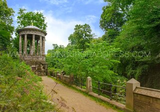 Iconic St Bernard's Well in a lush background