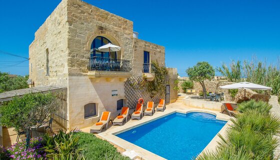 Three bedroom holiday homes in Gozo - A traditional building in Gozo with a blue pool Three bedroom holiday homes in Gozo - A traditional building in Gozo with a blue pool