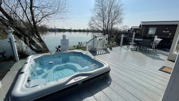 balcony hot tub view - fishing lake view, full wrap around veranda with large hot tub with a private fishing peg
