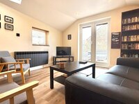 Living area with flat screen TV.