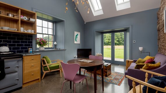 Holiday Home in the Countryside - Inviting lounge area with comfortable seating, stylish décor and a stunning view of nature