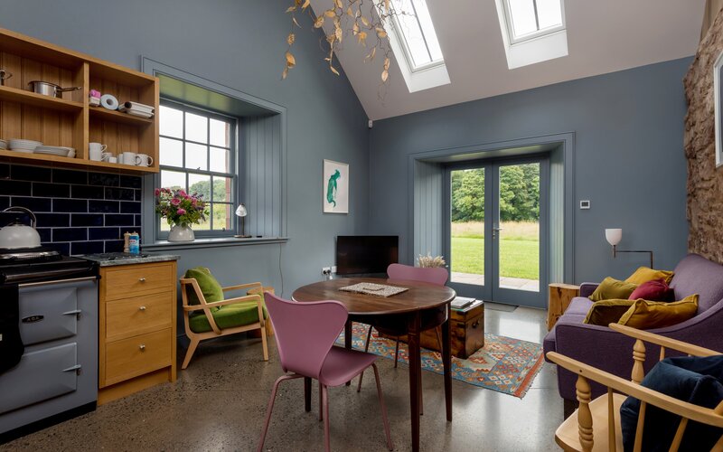 Holiday Home in the Countryside - Inviting lounge area with comfortable seating, stylish décor and a stunning view of nature