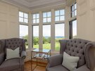 St Aidans - Grey winged armchairs, and stunning view across the garden in North Berwick rental accommodation.