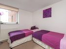 Dunlop Street 9 - Twin bedroom with purple decor at Glasgow holiday let