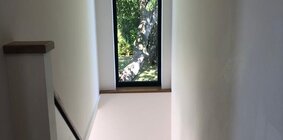 Scandi style staircase with garden view