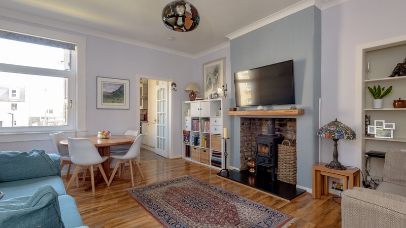49604_MarketPlace-003 - Living room / dining area with wood burning stove in North Berwick holiday home. 49604_MarketPlace-003 - Living room / dining area with wood burning stove in North Berwick holiday home.