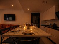 Modern dining and living space at dusk